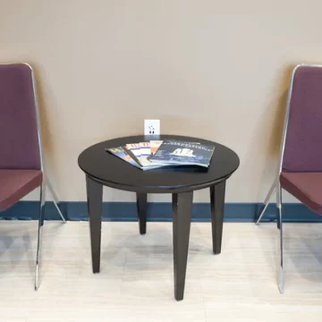 Waiting area with chairs and magazine table - Ascent ER