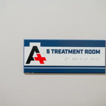 Treatment Room signage on wall - Emergency room in Houston