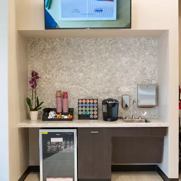 Waiting room at Ascent ER with coffee machine and decor